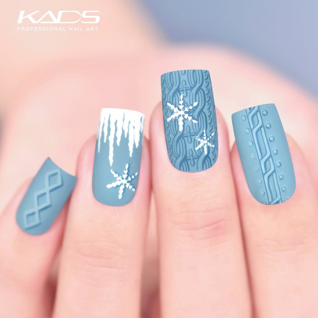 Blue and White Snowflake Nails